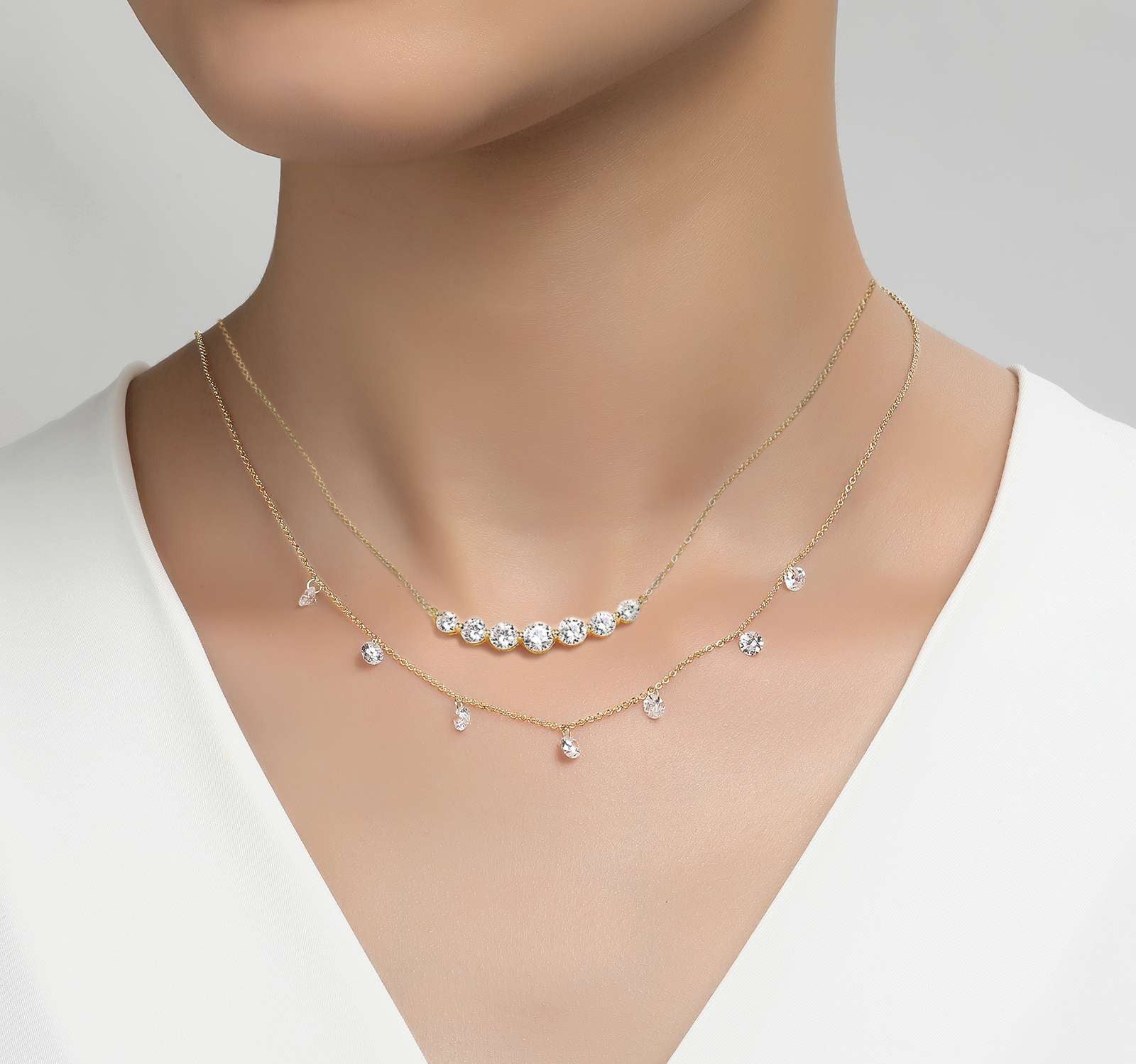 a woman wearing a beautiful diamond necklace
